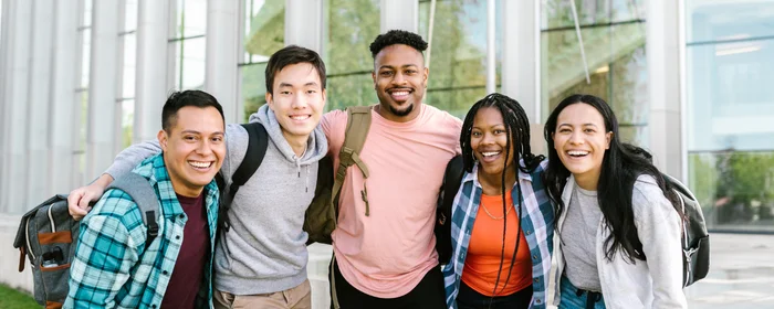a group of college students taking group picture to use on zaarvis website